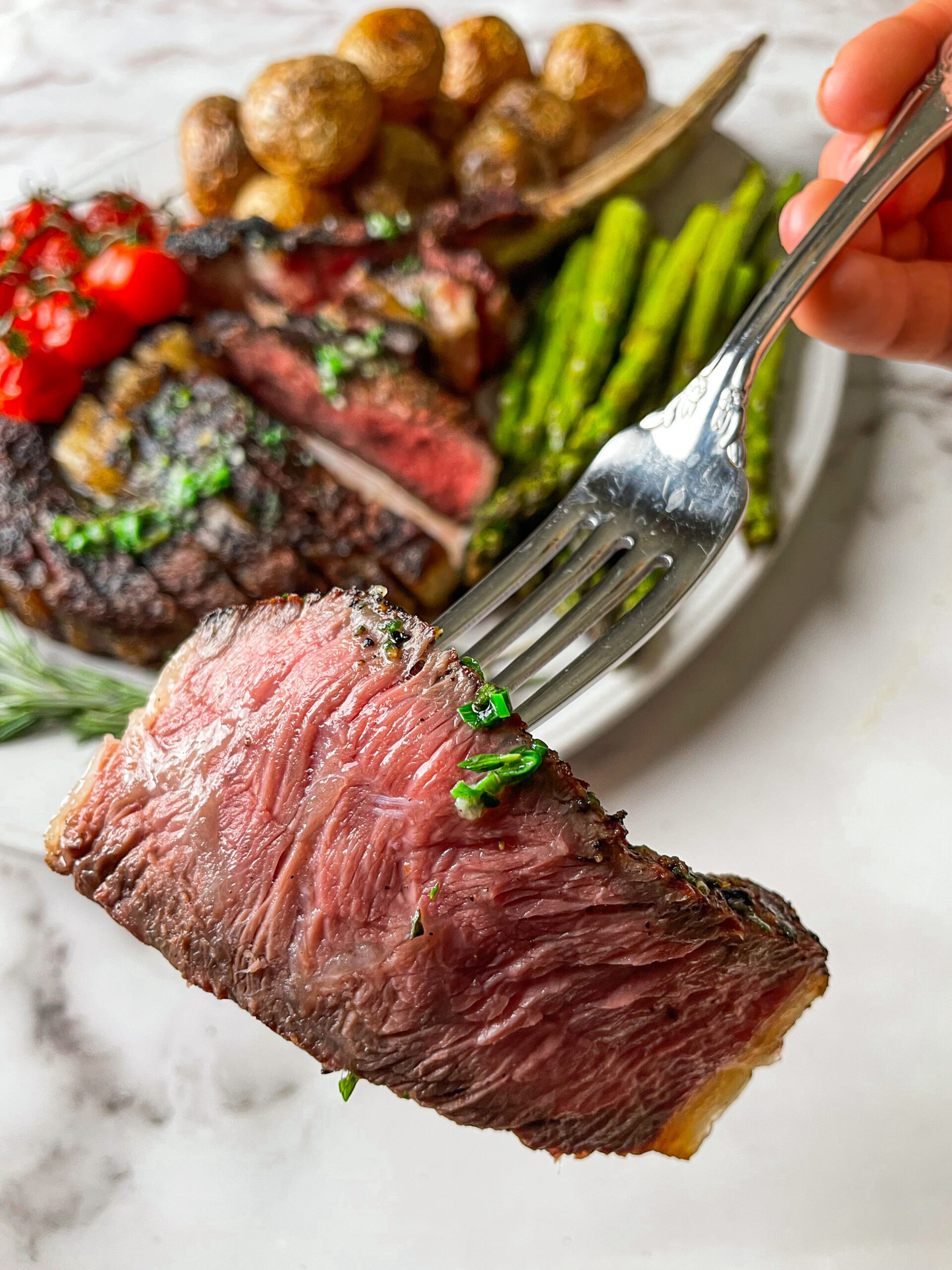 Tomahawk Steak cooked to medium rare is removed from the grill at 125ºF to rest.